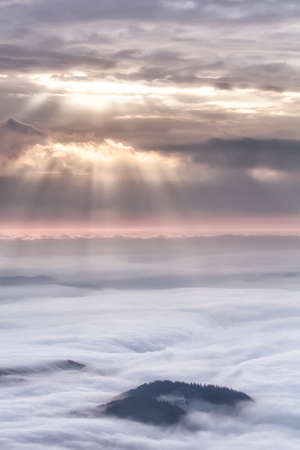 Beautiful mountain landscape of a foggy morning, Ceahlau massif, Eastern Carpathians, Moldova,...