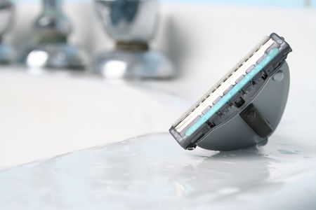 Closeup of a sink; very brightの写真素材