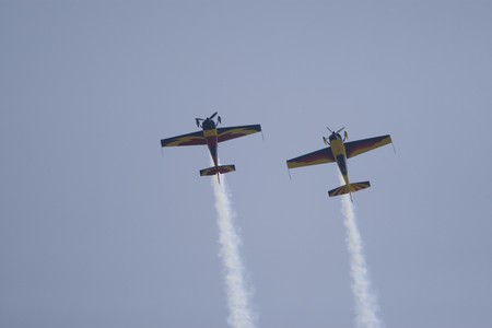 Acrobatic airplane performing during an airshow in Bucharest, Romania.の写真素材