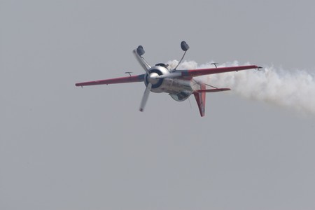 BUCHAREST, ROMANIA - JULY 17: Acrobatic airplanes perform during the airshow on July 17, 2010 on Henri Coanda airport, Bucharest, Romania.のeditorial素材