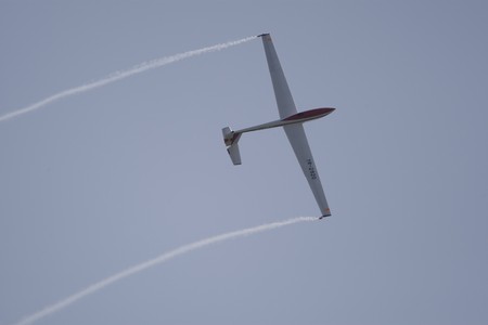 BUCHAREST, ROMANIA - JULY 17: Acrobatic gliders perform during the airshow on July 17, 2010 on Henri Coanda airport, Bucharest, Romania.のeditorial素材