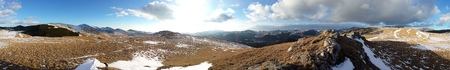 Mountain top panorama at sunset on a warm winter evening near Sinaia, Romaniaの写真素材