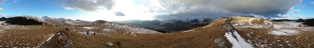 Mountain top panorama at sunset on a warm winter evening near Sinaia, Romania