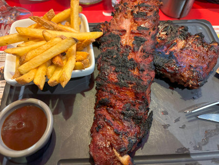 Delicious pork ribs with french fries and barbeque sauceの写真素材