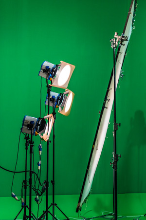 Three light projectors with diffusion filters are shining through a big diffusion frame.の写真素材