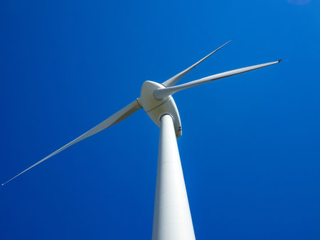 close-up portrait of wind turbine in blue sky