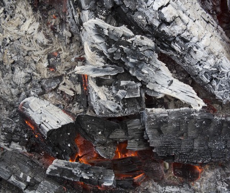 Decaying coals for cooking and a background