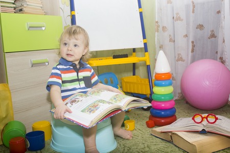 little boy sitting on pottyの写真素材