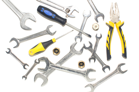 Brilliant keys and pliers on a white background.の写真素材