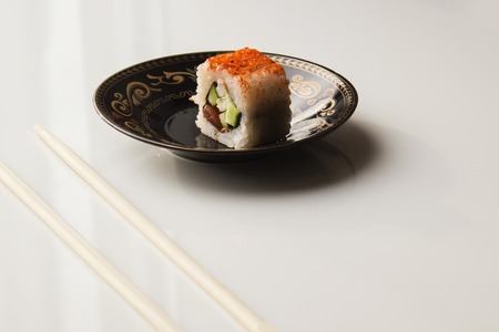 Sushi plate against a white background and chopsticksの写真素材