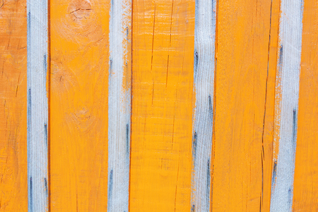 The fence in bright orange paint, bright backgroundの写真素材
