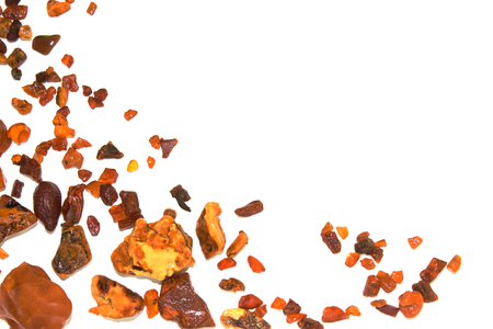 Eight different pieces of amber on a white background.の写真素材