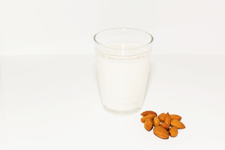 Glass of almond milk isolated on white.の写真素材