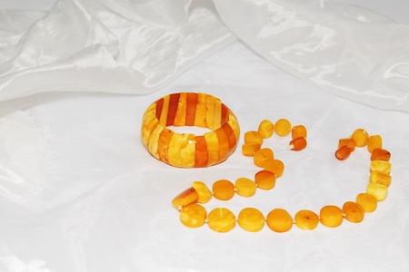Amber necklace on a light background, jewelry made of natural amber.