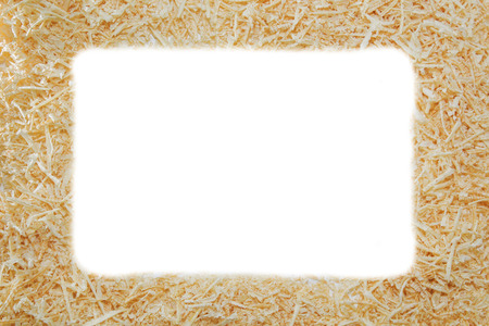 A lot of wood chips on light white background.の写真素材