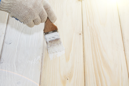 Bank paints and brush on a wooden backgroundの写真素材