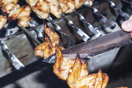 Marinated shashlik preparing on a barbecue grill over charcoal. Shashlik or Shish kebab popular in Eastern Europeの写真素材