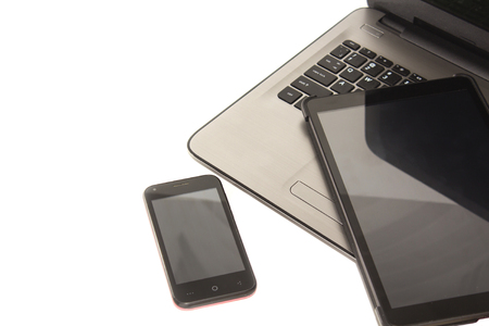 Laptop tablet and smartphone on white or gray wood table background with text space and copy space, Responsive Web Design.の写真素材