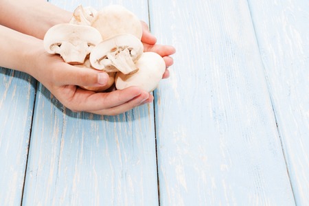 Organic mushrooms. Health food. Fresh mushrooms in the handsの写真素材