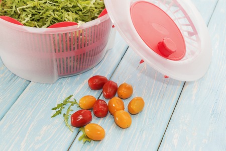 micro greens grass in white drier and cherry tomatoesの写真素材