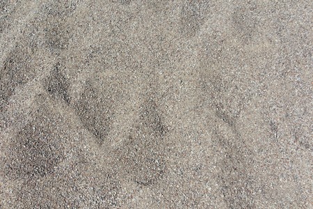 Coarse sand background texture. Close up of coarse sand grainsの写真素材