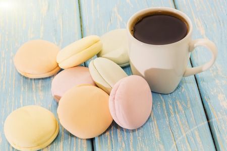 A Cup of coffee with Marshmallows on a light blue background .の写真素材