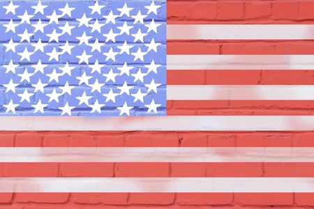 united states of america flag painted on old brick wall texture background.の写真素材