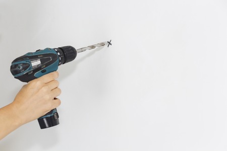 Builder or worker drilling with a machine or drill.の写真素材