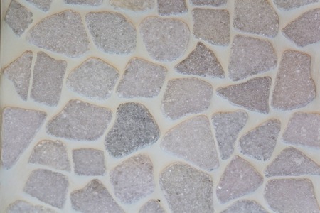 The stone floor is decorated with a variety of geometric mosaic, blue, red, white, black tile. Abstract geometric chaotic pattern.の写真素材