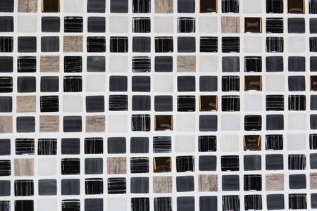 The stone floor is decorated with a variety of geometric mosaic, blue, red, white, black tile....