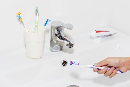 Toothpaste on a toothbrush, close-up. teeth careの写真素材