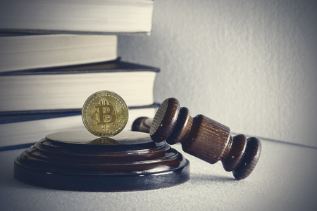 judges hammer and bitcoin gold coin. Digital currency.の写真素材