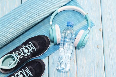 Yoga Mat, sports shoes, water bottle concept of healthy living, healthy eating, sports and diet.の写真素材
