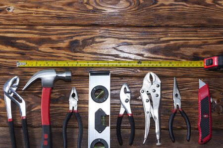 Close up tools on a wooden background