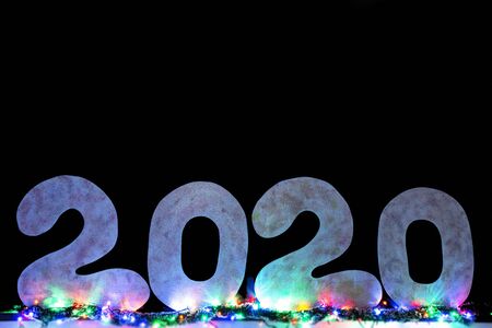 Happy new year 2020 isolated on black background with copy space for text, for holiday card. Blurred snowflakes, snowの写真素材
