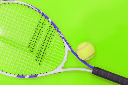 Tennis on a bright background, racket, ball, . Photographed in the Studio.の写真素材