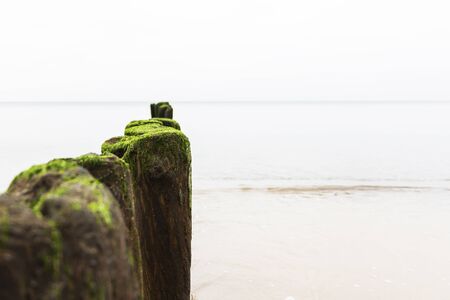 the breakwater on a calm beautiful sea.の写真素材