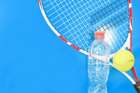 Tennis on a bright background, racket, ball, . Photographed in the Studio.の写真素材