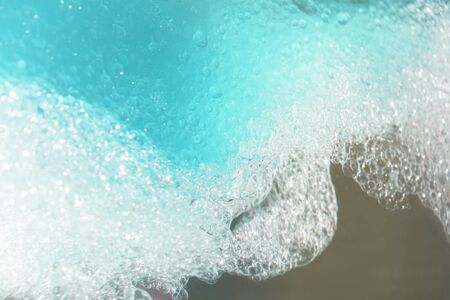 blue water with bubbles and blue drops background.