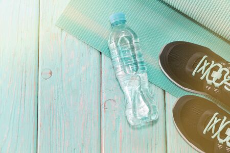 Yoga Mat, sports shoes, water bottle, the concept of a healthy lifestyle.の写真素材