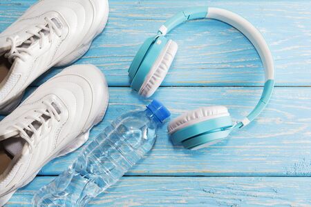 The concept of fitness with my running shoes and headphones. Top view with space for textの写真素材