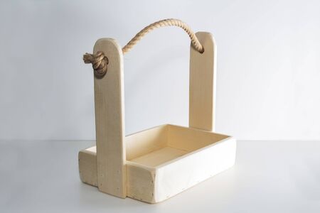 Empty wooden box. Made of pine, on a light white background.