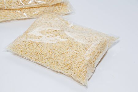 wood shavings in a bag on a light background, filler