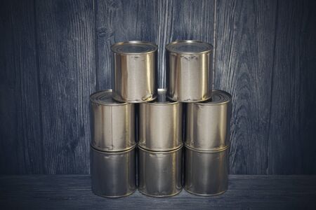 A number of closed metal sealed food cans, food supply, crisis
