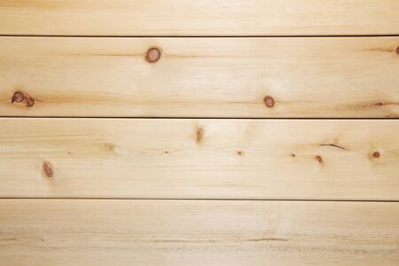 Light brown wood texture with horizontal slats, table or wall surface.