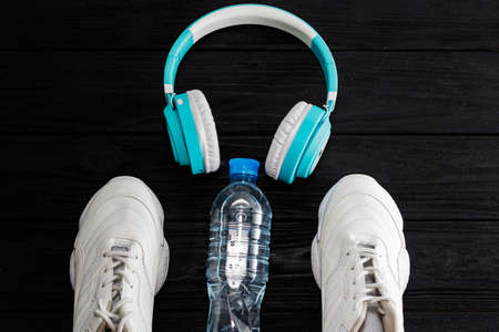 The concept of fitness with my running shoes and headphones. Top view with space for text.の写真素材
