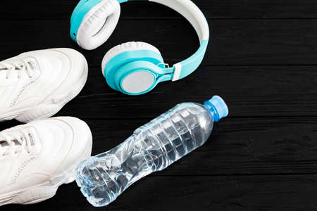 The concept of fitness with my running shoes and headphones. Top view with space for textの写真素材