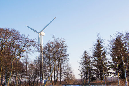 Wind generator on the background of the forest line. Clean energy. Protection of the environment.の写真素材