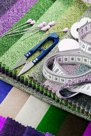Pieces of cloth with scissors, needle and thread. Tailoring, manufacture of upholstered furniture.の写真素材