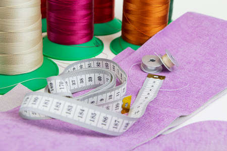 Pieces of fabric and thread. Tailoring, production of clothing and upholstered furniture